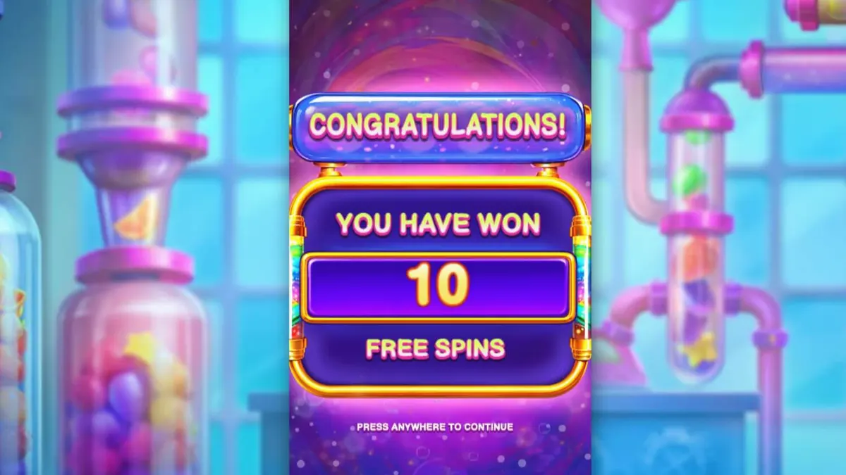 Interface colorida e industrial do slot Sweet Burst com doces e tubos de laboratório.